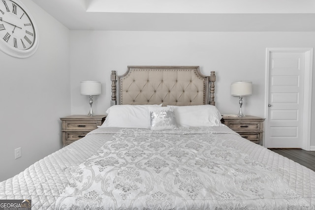 bedroom with wood finished floors