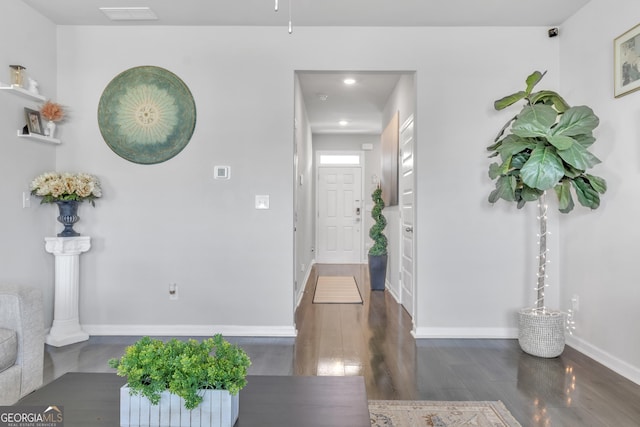 entryway featuring dark wood-style flooring, baseboards, visible vents, and recessed lighting