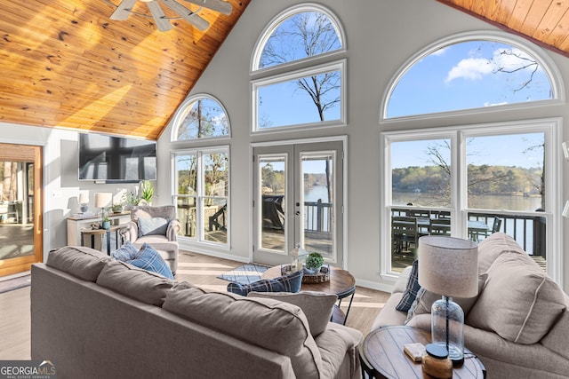 109 Shelton Ln, Eatonton, GA 31024 - living room featuring wooden ceiling, dark wood-style flooring, a stone fireplace, ceiling fan, and high vaulted ceiling