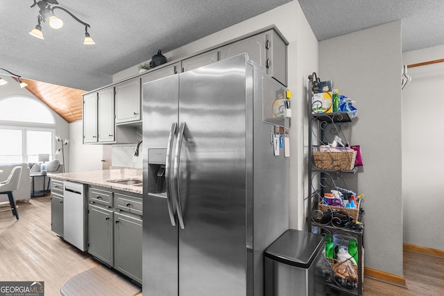 109 Shelton Ln, Eatonton, GA 31024 - kitchen featuring gray cabinetry, a sink, and stainless steel appliances
