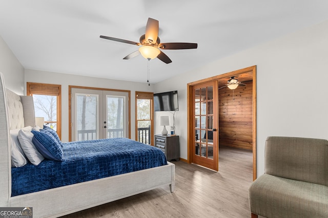 109 Shelton Ln, Eatonton, GA 31024 - bedroom featuring access to outside, french doors, wood finished floors, and multiple windows
