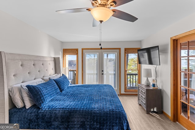 109 Shelton Ln, Eatonton, GA 31024 - bedroom featuring french doors, access to exterior, multiple windows, and wood finished floors