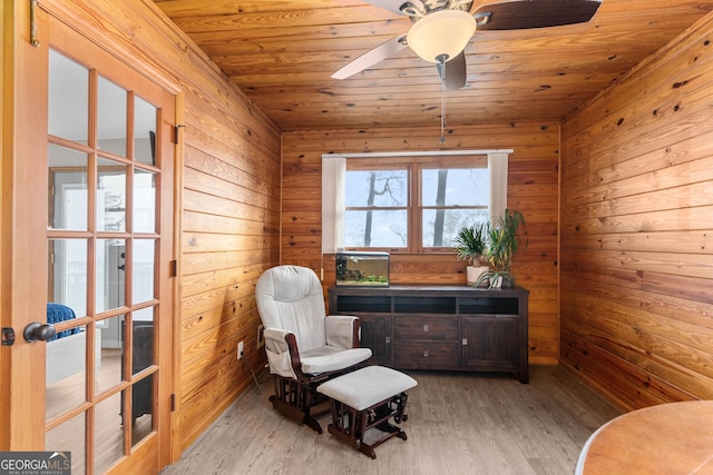 109 Shelton Ln, Eatonton, GA 31024 - home office with light wood-style floors, wood walls, ceiling fan, and wood ceiling