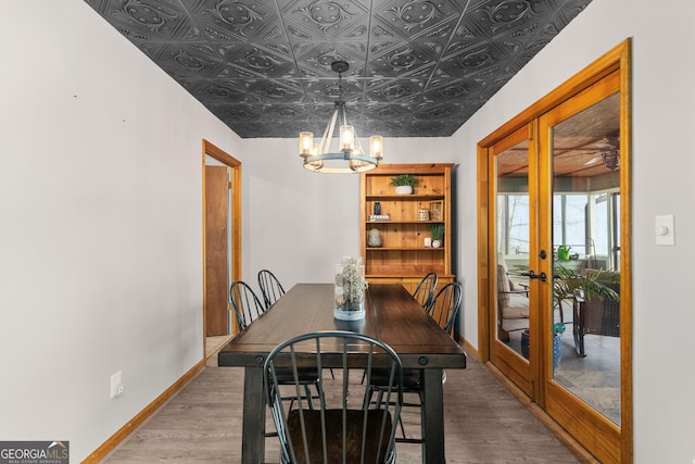 109 Shelton Ln, Eatonton, GA 31024 - bathroom with a chandelier, toilet, and tile walls