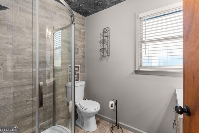 109 Shelton Ln, Eatonton, GA 31024 - bathroom with toilet, baseboards, and a stall shower