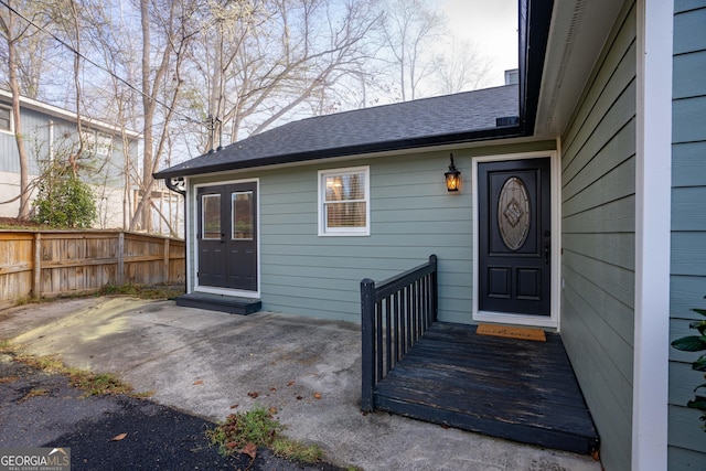109 Shelton Ln, Eatonton, GA 31024 - doorway to property with a shingled roof and fence