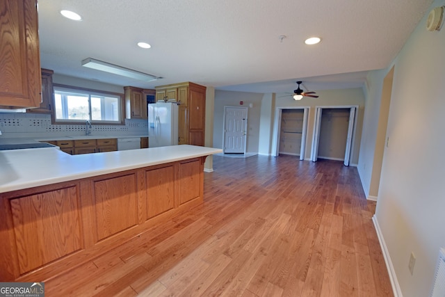 3112 Allison Ct, Young Harris, GA 30582 - kitchen featuring light countertops, a sink, tasteful backsplash, a peninsula, and white appliances