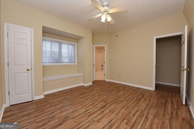 3112 Allison Ct, Young Harris, GA 30582 - unfurnished bedroom featuring visible vents, wood finished floors, and a textured ceiling