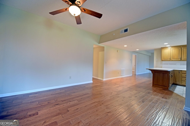 3112 Allison Ct, Young Harris, GA 30582 - unfurnished living room featuring baseboards, light wood finished floors, and visible vents