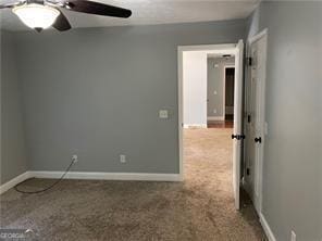 370 Rainey Dr, Dawsonville, GA 30534 - carpeted empty room with baseboards and ceiling fan