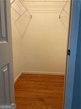 370 Rainey Dr, Dawsonville, GA 30534 - spacious closet featuring wood finished floors