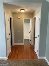 370 Rainey Dr, Dawsonville, GA 30534 - hallway with baseboards and wood finished floors