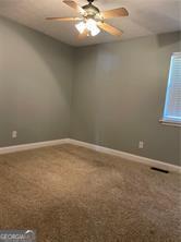 370 Rainey Dr, Dawsonville, GA 30534 - carpeted spare room with baseboards, ceiling fan, and visible vents
