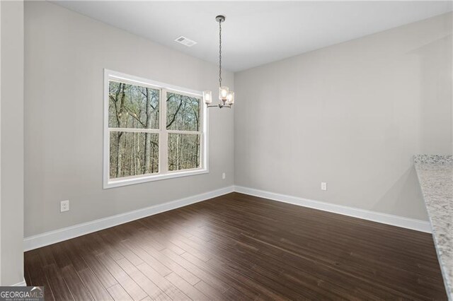 5726 Ridgewater Cir, Gainesville, GA 30506 - unfurnished room with baseboards, dark wood-style flooring, visible vents, and a chandelier