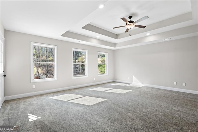 5726 Ridgewater Cir, Gainesville, GA 30506 - spare room featuring a tray ceiling, baseboards, carpet flooring, and a ceiling fan