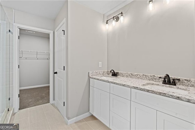 5726 Ridgewater Cir, Gainesville, GA 30506 - full bathroom with a walk in closet, tiled shower, tile patterned flooring, and a sink