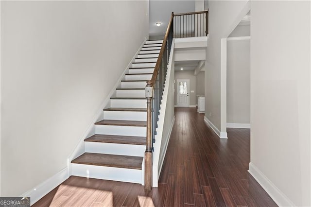 5726 Ridgewater Cir, Gainesville, GA 30506 - staircase with a high ceiling, baseboards, and wood finished floors