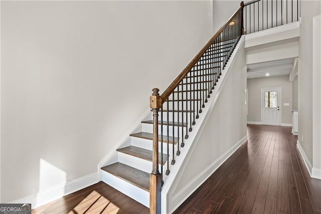 5726 Ridgewater Cir, Gainesville, GA 30506 - stairway with a towering ceiling, hardwood / wood-style flooring, and baseboards