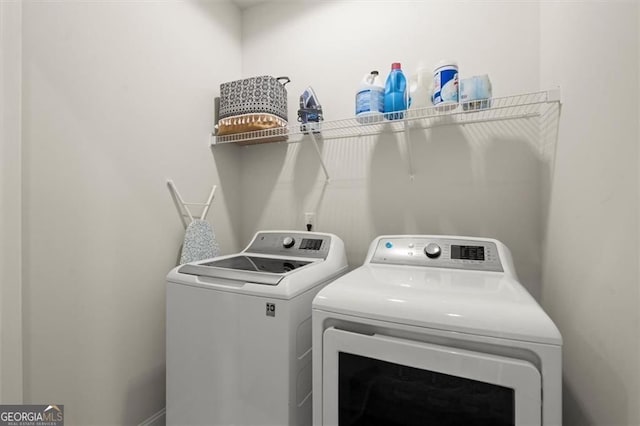 laundry room featuring laundry area and washer and clothes dryer