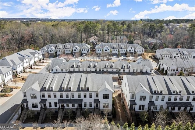 birds eye view of property with a residential view