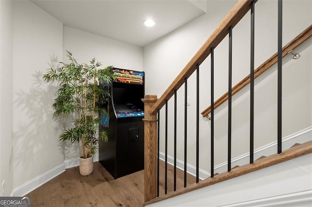 stairs with recessed lighting, baseboards, and wood finished floors