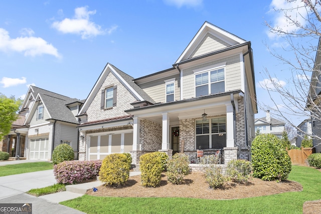 11395 Crestview Ter, Johns Creek, GA 30024 - view of front of house with a porch, an attached garage, brick siding, fence, and concrete driveway