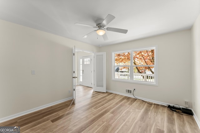 385 Jayne Ellen Way, Alpharetta, GA 30009 - empty room with light wood-style flooring, a ceiling fan, and baseboards