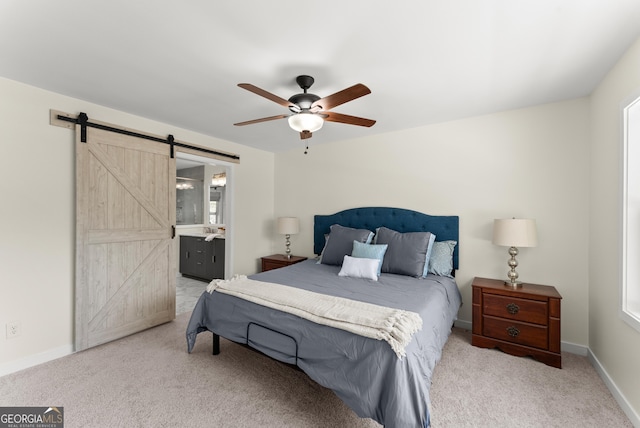 385 Jayne Ellen Way, Alpharetta, GA 30009 - bedroom with a barn door, carpet floors, baseboards, and a ceiling fan