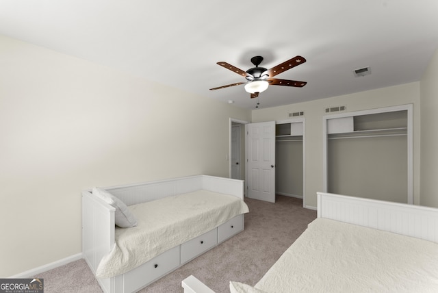 385 Jayne Ellen Way, Alpharetta, GA 30009 - bedroom featuring carpet floors, two closets, baseboards, and a ceiling fan