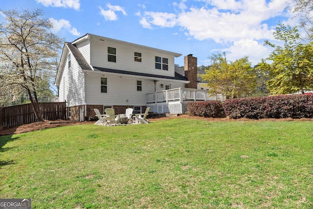 385 Jayne Ellen Way, Alpharetta, GA 30009 - rear view of house featuring a wooden deck, a chimney, brick siding, and an outdoor fire pit