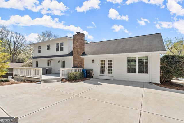 385 Jayne Ellen Way, Alpharetta, GA 30009 - back of property with french doors, a chimney, and a wooden deck