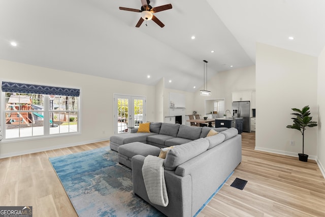 385 Jayne Ellen Way, Alpharetta, GA 30009 - living area featuring ceiling fan, light wood-style floors, high vaulted ceiling, baseboards, and french doors