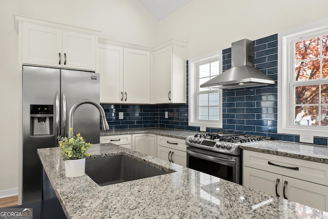 385 Jayne Ellen Way, Alpharetta, GA 30009 - kitchen with stainless steel appliances, wall chimney range hood, a sink, white cabinetry, and light stone countertops