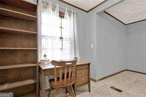 carpeted office with baseboards