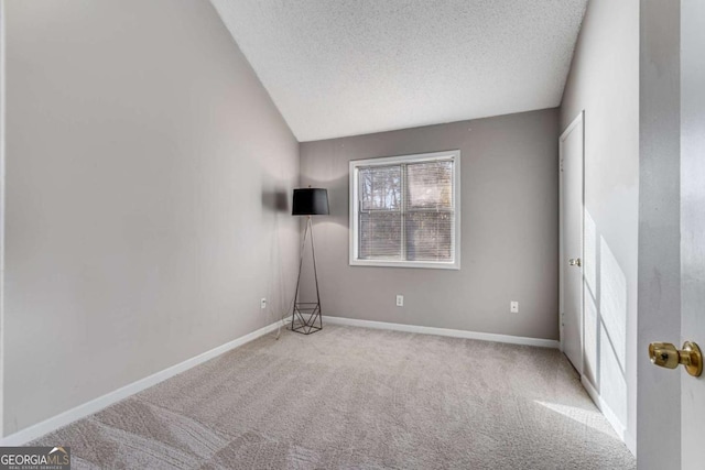 4519 Glenforest Dr NE, Roswell, GA 30075 - spare room featuring baseboards, carpet floors, and a textured ceiling
