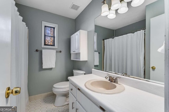 4519 Glenforest Dr NE, Roswell, GA 30075 - bathroom with toilet, vanity, baseboards, and visible vents