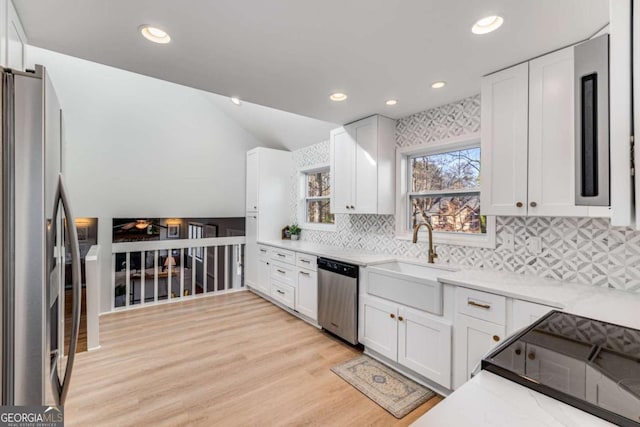 4519 Glenforest Dr NE, Roswell, GA 30075 - kitchen with white cabinets, a sink, and appliances with stainless steel finishes