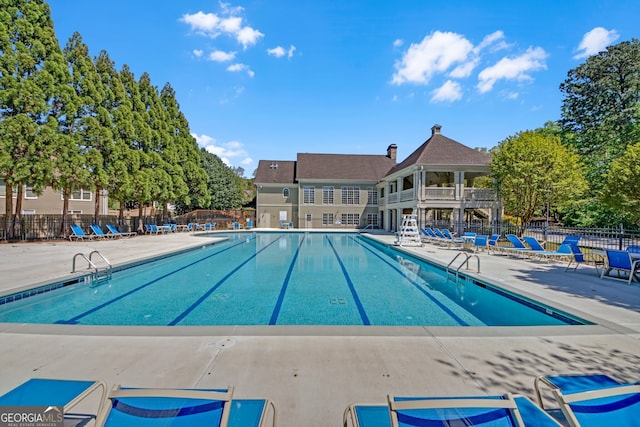 1210 Spring Branch Ct, Lawrenceville, GA 30045 - community pool featuring a patio area
