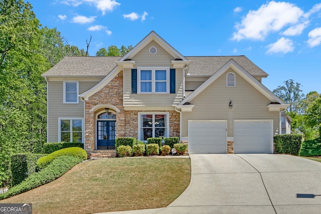 1210 Spring Branch Ct, Lawrenceville, GA 30045 - view of front of property featuring stone siding, concrete driveway, french doors, a front lawn, and a shingled roof