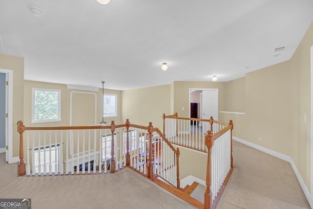 1210 Spring Branch Ct, Lawrenceville, GA 30045 - hallway with an upstairs landing and carpet flooring