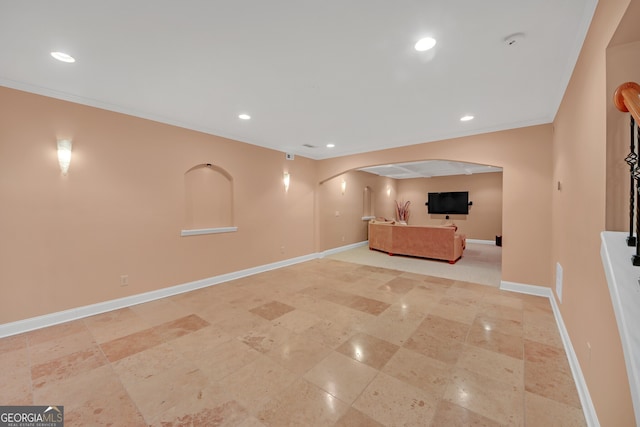 1210 Spring Branch Ct, Lawrenceville, GA 30045 - unfurnished living room featuring arched walkways, recessed lighting, and crown molding