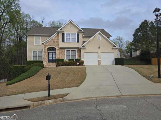 1210 Spring Branch Ct, Lawrenceville, GA 30045 - traditional-style house featuring stone siding, driveway, a garage, and french doors