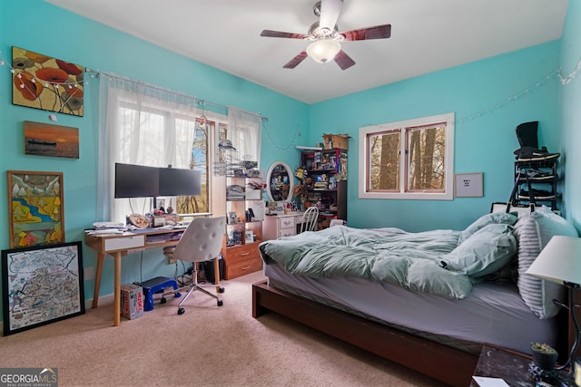 carpeted bedroom featuring a ceiling fan