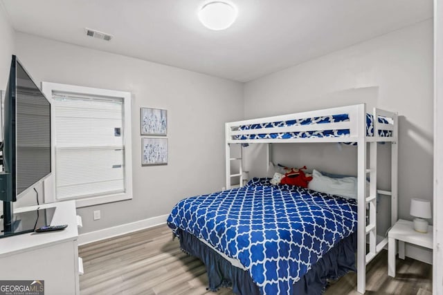 1115 Martin Luther King Jr Dr SW, Atlanta, GA 30314 - bedroom featuring baseboards, visible vents, and wood finished floors