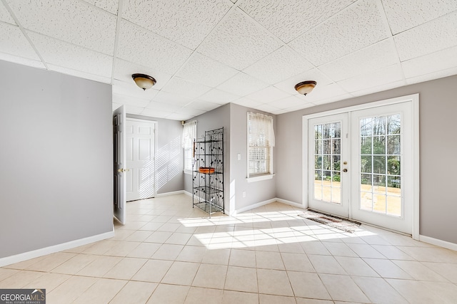 5045 Southern Trace Dr, Gainesville, GA 30504 - unfurnished room with french doors, a drop ceiling, baseboards, and light tile patterned floors