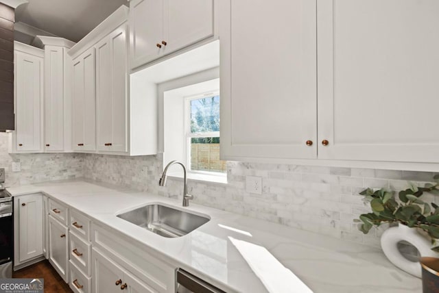 112 E Fambrough St, Monroe, GA 30655 - kitchen with stainless steel appliances, a sink, crown molding, decorative backsplash, and baseboards