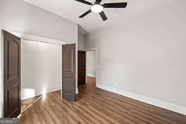 112 E Fambrough St, Monroe, GA 30655 - empty room featuring wood finished floors, ceiling fan, and baseboards