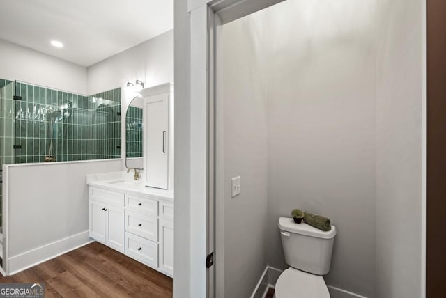 112 E Fambrough St, Monroe, GA 30655 - full bath featuring a shower stall, vanity, wood finished floors, a freestanding tub, and tile walls