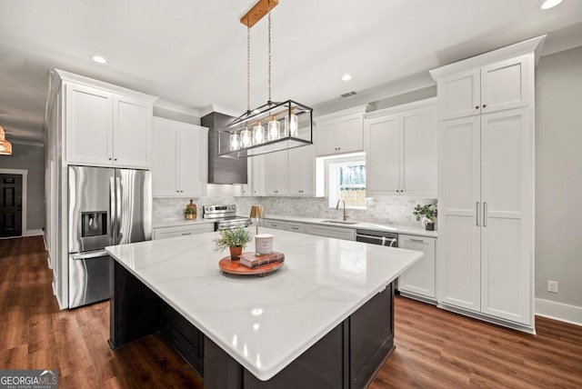 112 E Fambrough St, Monroe, GA 30655 - unfurnished living room featuring crown molding, baseboards, a large fireplace, a ceiling fan, and wood finished floors