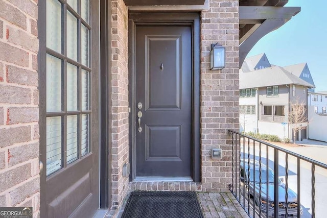 doorway to property featuring a balcony